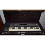 An Ensoniq SQ80 synthesizer, cased, with stand