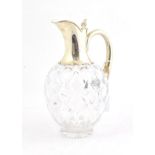 A Victorian Silver-Mounted Glass Claret-Jug, by John Grinsell and Sons, London, 1897. The diamond-