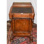 A Victorian figured walnut Davenport, with three-quarter gilt metal gallery to the lidded pen box,