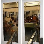 A pair of tall wall mirrors with bevelled borders, 60cm by 150cm