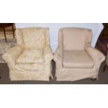 Two Victorian upholstered wing back armchairs on castors (2). A pair with different covers and