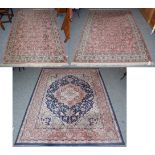 A machine made rug, the pink ground the pink field with all over design, 195cm by 139cm, together