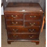 A George III oak chest of small proportions, the top two drawers converted to a cupboard, 66cm by