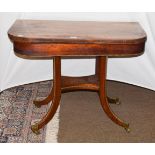 A 19th century rosewood fold-over card table with gilt metal mounts, 92cm by 45cm by 73cm (a.f.)