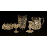 A Belleek basket moulded jug, together with a pair of smaller examples, and a group of cut glass