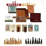 Two trays of assorted games and cards, including a turned wooden chess set, and a 19th century