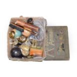 Box of various collectibles including miniature globes, music boxes, desk, bells and a single volume