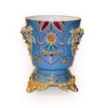 A Limoges porcelain planter on stand, turquoise ground, enamelled with stylised flower and moulded