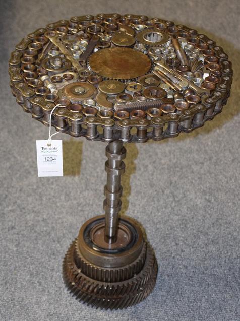 A Steampunk Industrial metal table, constructed using various industrial sprockets, gears, spanners,