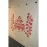 19th century white quilt with large red cotton appliquéd image of a central pedestal vase of