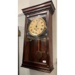 An oak cased Gledhill-Brook Time Recorders Ltd wall clock, 83cm together with an oak door (2)
