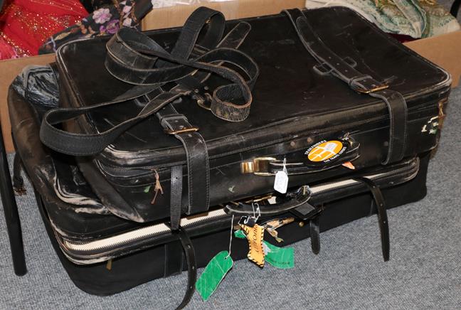 Three graduated black Tanner Krolle suitcases made for Harrods, the largest with canvas protector,