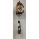 A lantern form hook and spike striking wall clock, unsigned, late 18th century, lantern form case
