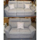 A Parker Knoll grey upholstered electric reclining three-seater settee 209cm by 87cm by 98cm