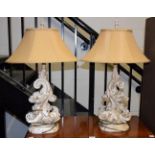 A pair of composition table lamps in the rococo taste modelled as scrolling acanthus leaves with