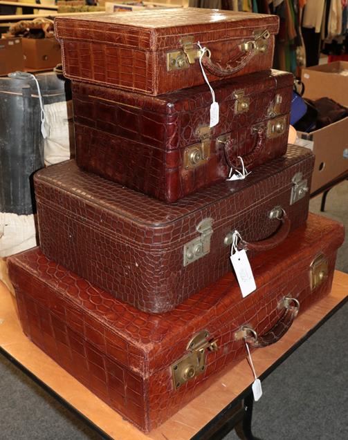 Brown crocodile mounted dressing case, with hinged cover enclosing three compartments with glass