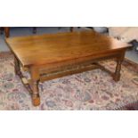 A Wood Brothers reproduction oak coffee table of rectangular form, raised on spindle turned legs