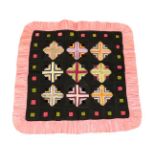 An Early 20th Century Decorative Patchwork Cushion Cover/Panel, worked in black, pink and other