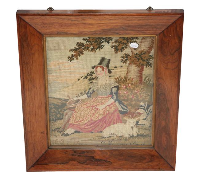 19th Century Wool Work Picture of a Seated Lady in 'Welsh Costume', seated by a tree with a lamb