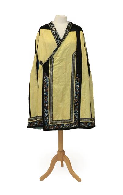 Early 20th Century Chinese Yellow Silk Brocade Cape with black silk shoulders, applied,