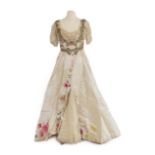 A Late 19th Century Ladies' Evening Dress, in cream silk with short net and lace pleated sleeves,