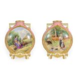 A Pair of Royal Worcester Porcelain Moon Flasks, circa 1872, with moulded angular handles and feet,