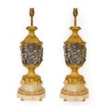 A Pair of Silvered and Gilt Bronze Lamp Bases, after Clodion,