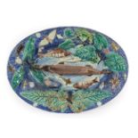 A Palissy Style Earthenware Dish, late 19th century, of oval form, moulded and applied with fish,