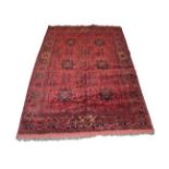 Afghan Turkmen Rug The compartmentalised field enclosed by narrow borders,