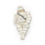 An Illuminated Michelin Man Advertising Figure, seated on a metal mounted bracket fitted with two-