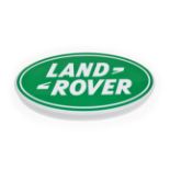 An Illuminated Car Display Sign: Land-Rover, with low voltage transformer, 58cm diameter