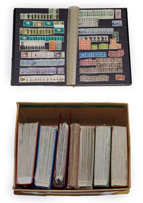 Carton containing 7 volumes incl. 5 large Lighthouse stockbooks with 10s of 1000s of stamps mainly