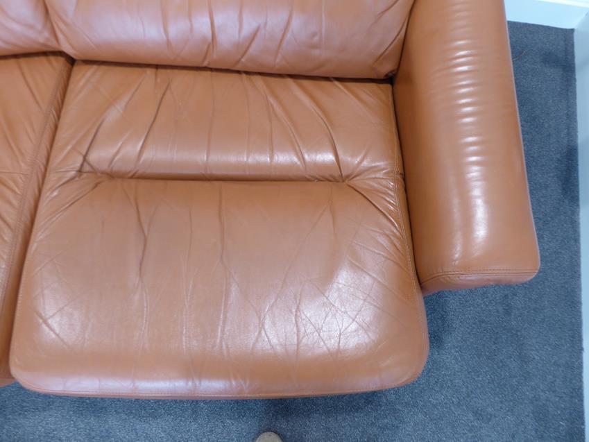 A Tetrad Brown Leather Sofa and Armchair, on brown castors, both labelled tetrad ENGLAND MAKERS OF - Image 8 of 26