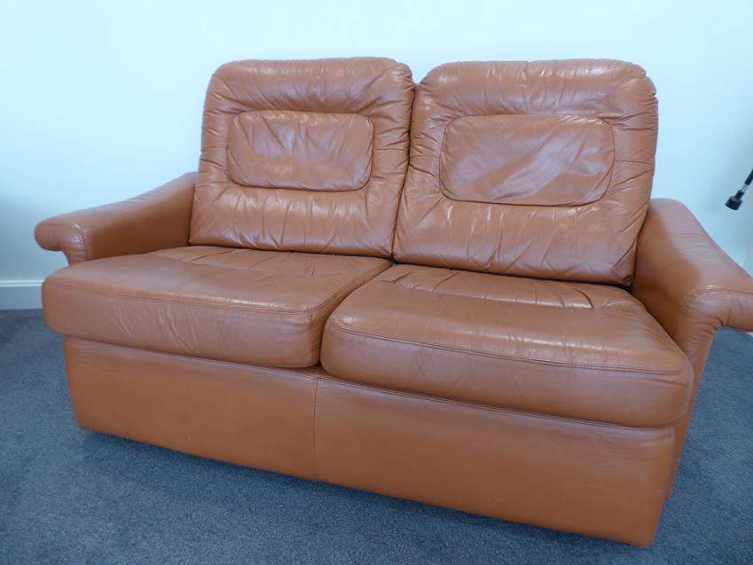 A Tetrad Brown Leather Sofa and Armchair, on brown castors, both labelled tetrad ENGLAND MAKERS OF - Image 2 of 26