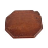 Robert Mouseman Thompson (1876-1955): An English Oak Bread Board, of canted rectangular shape,