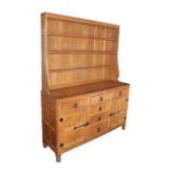 Workshop of Robert Mouseman Thompson (Kilburn): An English Oak Panelled 5ft Welsh Dresser, the