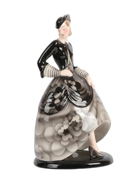 An Art Deco Goldscheider Pottery Figure, by Claire Weiss, modelled a woman wearing a floral black