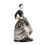 An Art Deco Goldscheider Pottery Figure, by Claire Weiss, modelled a woman wearing a floral black