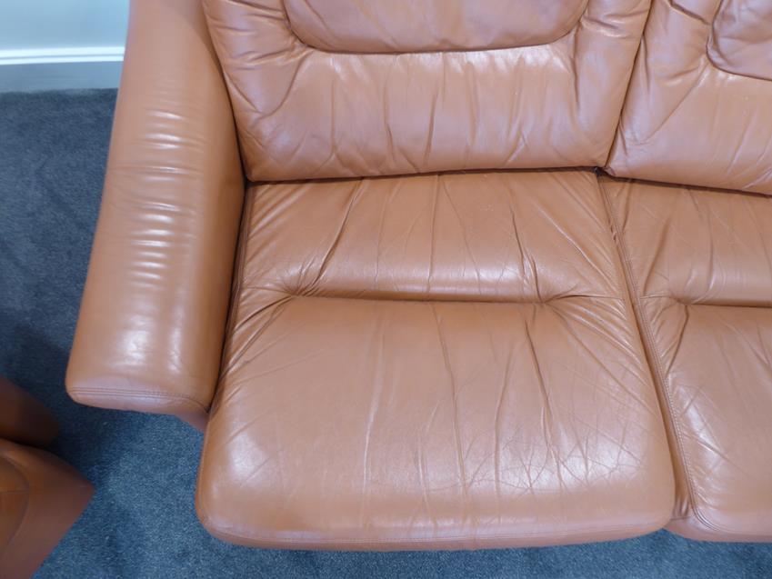 A Tetrad Brown Leather Sofa and Armchair, on brown castors, both labelled tetrad ENGLAND MAKERS OF - Image 9 of 26