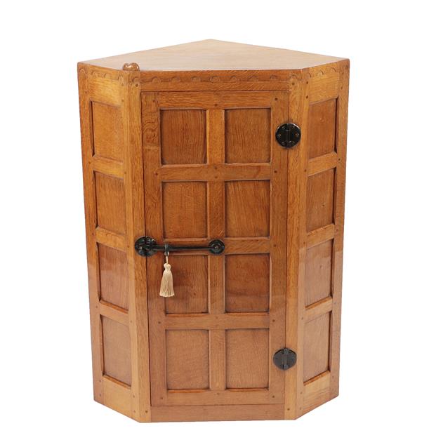 Workshop of Robert Mouseman Thompson (Kilburn): An English Oak Hanging Corner Cupboard, with