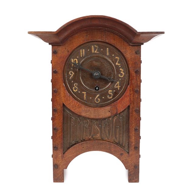 An Arts & Crafts Oak and Copper Mantel Clock, domed top, oak rivets, the hammered dial with Arabic