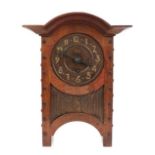 An Arts & Crafts Oak and Copper Mantel Clock, domed top, oak rivets, the hammered dial with Arabic