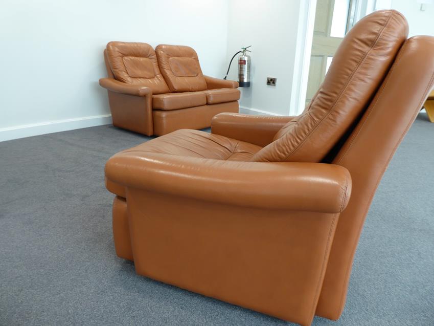 A Tetrad Brown Leather Sofa and Armchair, on brown castors, both labelled tetrad ENGLAND MAKERS OF - Image 23 of 26