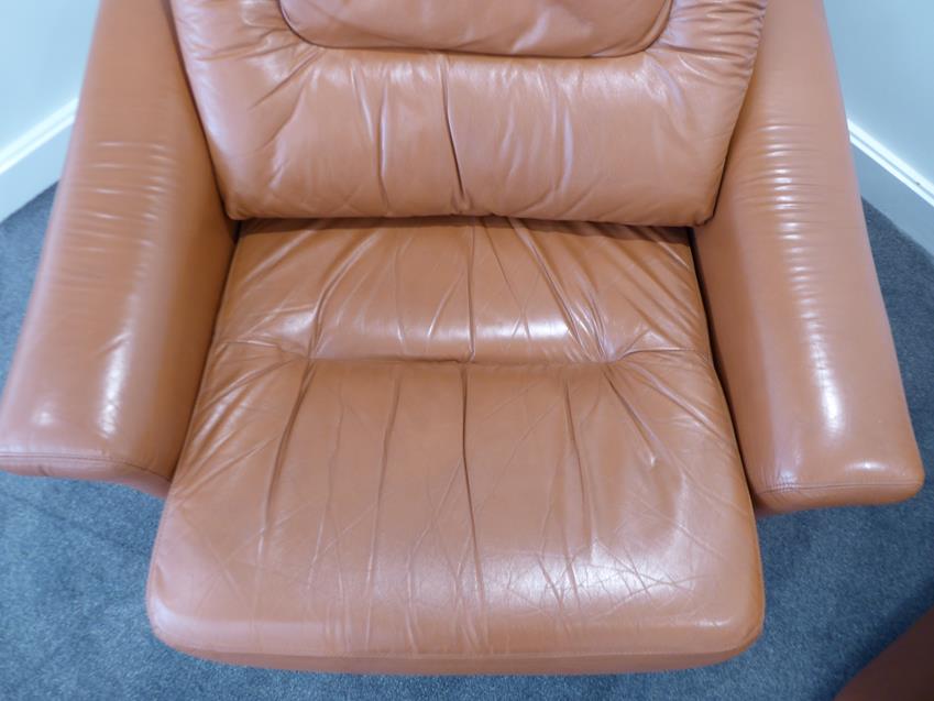 A Tetrad Brown Leather Sofa and Armchair, on brown castors, both labelled tetrad ENGLAND MAKERS OF - Image 18 of 26