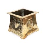 A Scottish Arts & Crafts Brass Planter, of square tapering form with projecting rim, repoussé