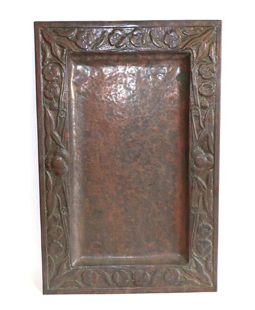 A Scottish Arts & Crafts Rectangular Copper Tray, repoussé decorated with flower heads and