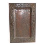 A Scottish Arts & Crafts Rectangular Copper Tray, repoussé decorated with flower heads and