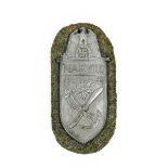 A German Third Reich Narvik Shield, Silver Class, Heer, with grey wool backing, the reverse with