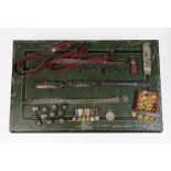 A Green and Black Japanned Tin Box of Militaria, including a Second World War group of six miniature