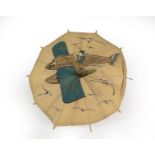 A Second World War Child's Advertising Umbrella, the white cotton canopy printed with a boy flying a